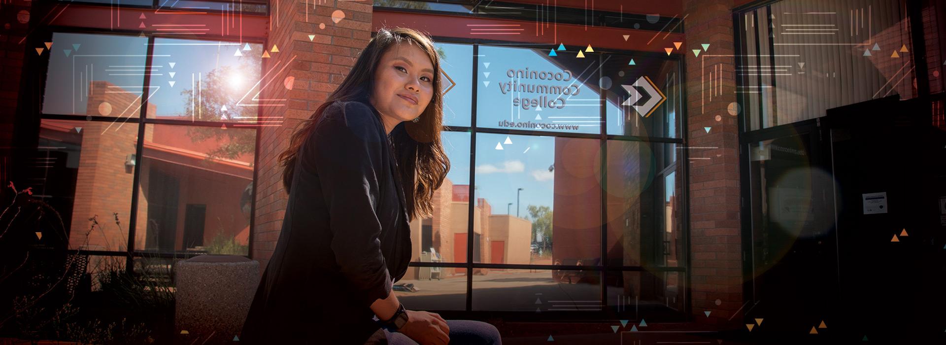 CCC student in front of the Page Campus Building